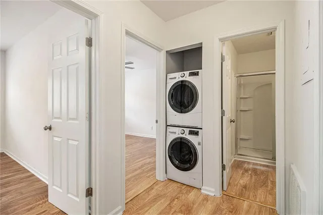 a view of a hallway with washer and dryer
