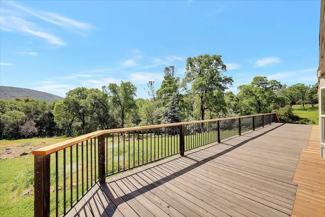 a view of a deck with a yard