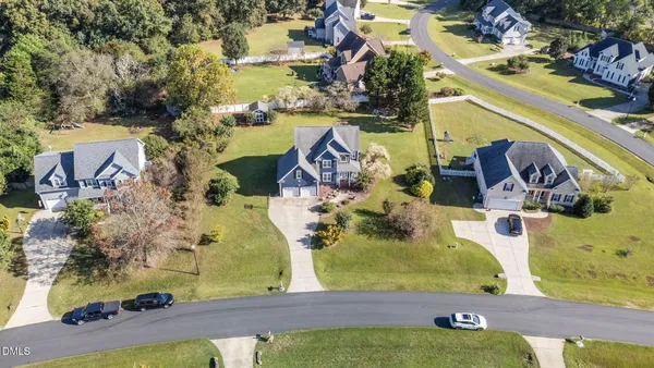 an aerial view of residential houses with outdoor space
