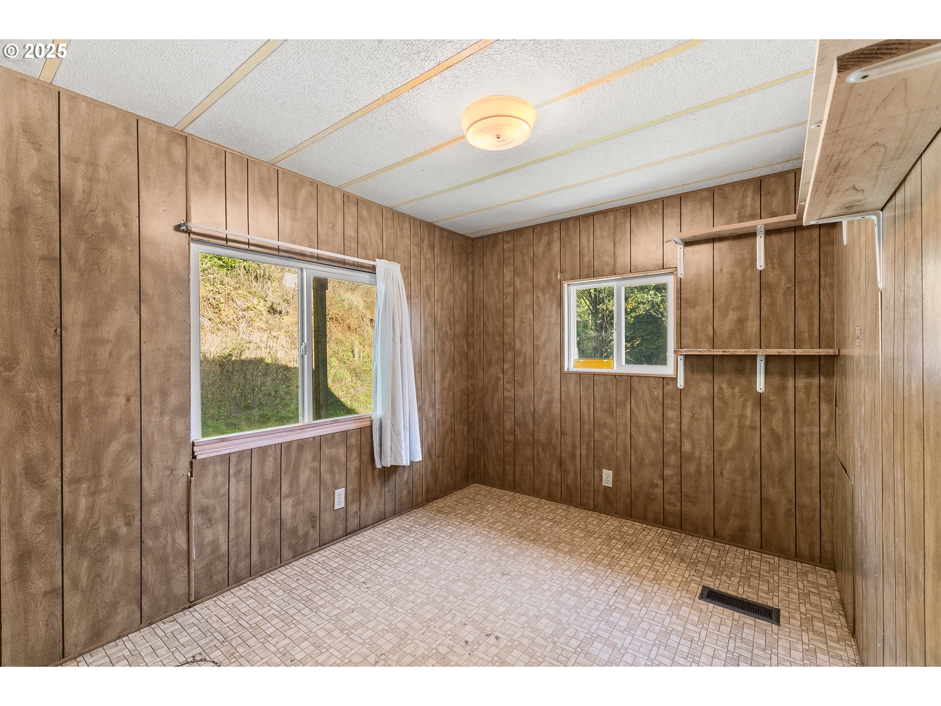 15779 Highway 42 Myrtle Point, OR 97458 - Photo 12 of 33 a view of an empty room with a window