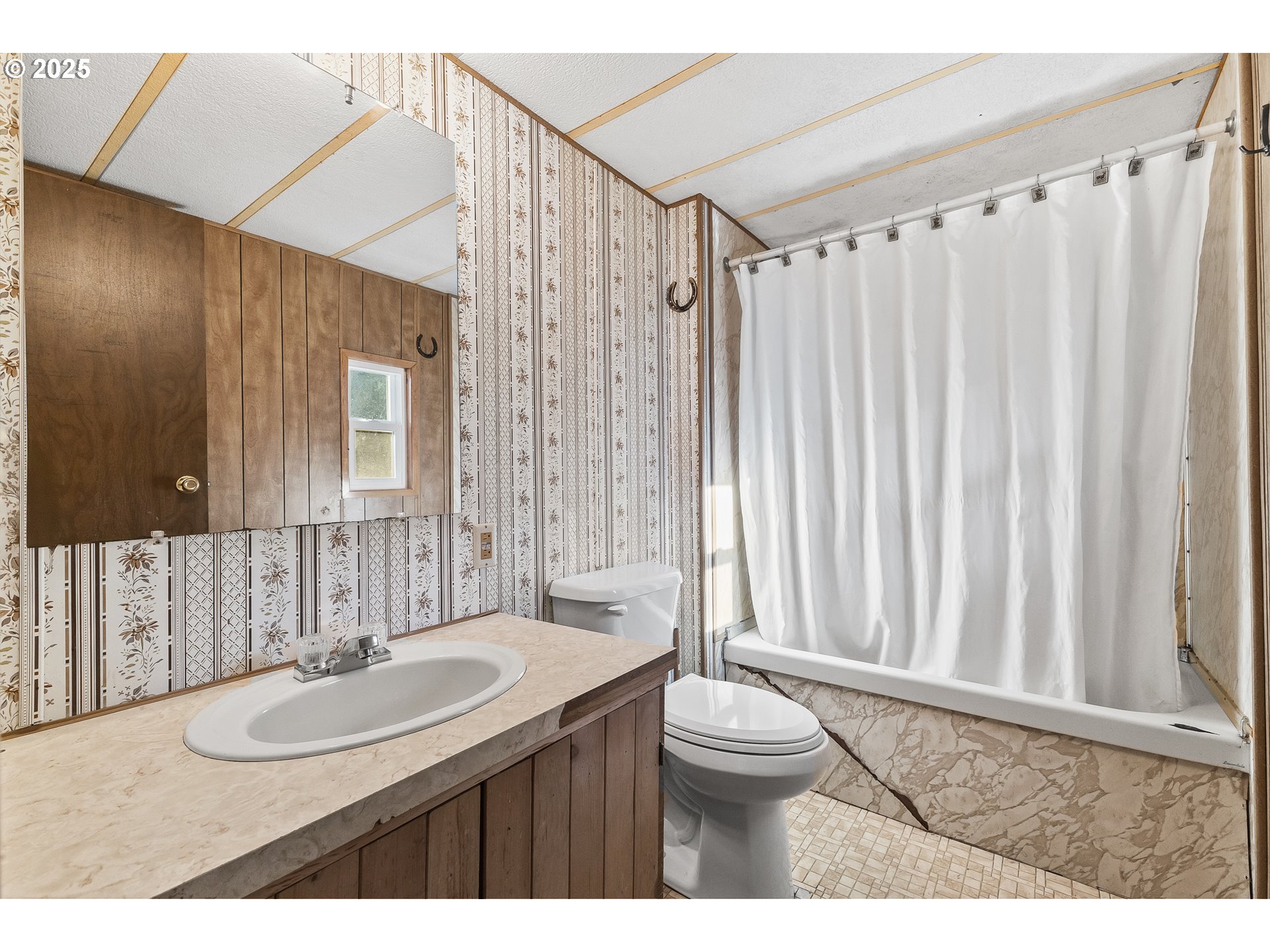 15779 Highway 42 Myrtle Point, OR 97458 - Photo 14 of 33 a bathroom with a sink a toilet and a mirror