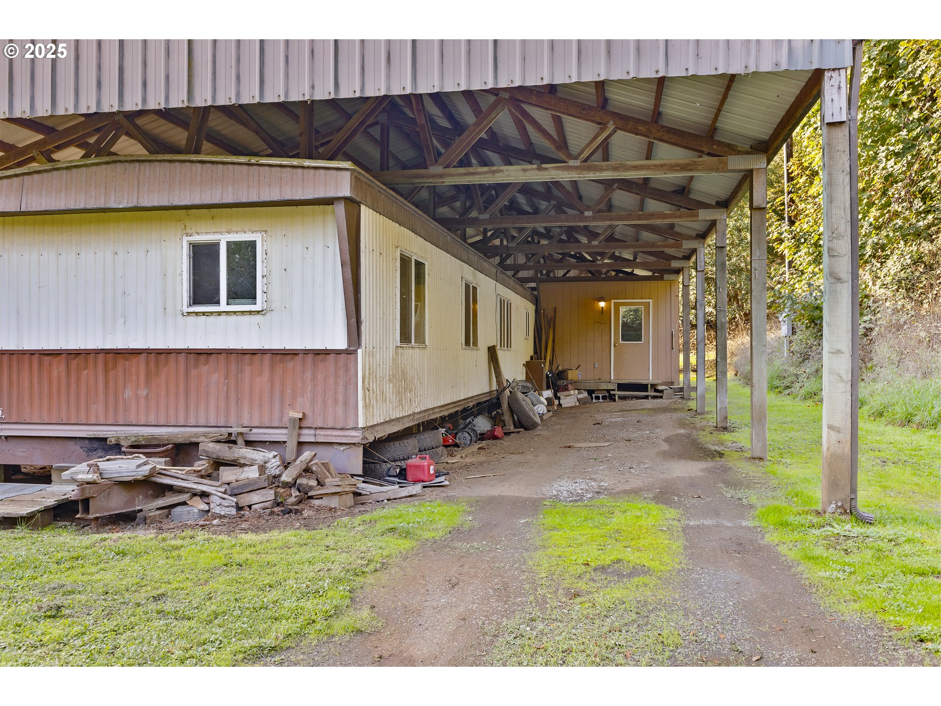 15779 Highway 42 Myrtle Point, OR 97458 - Photo 23 of 33 a view of a backyard with table and chairs under an umbrella