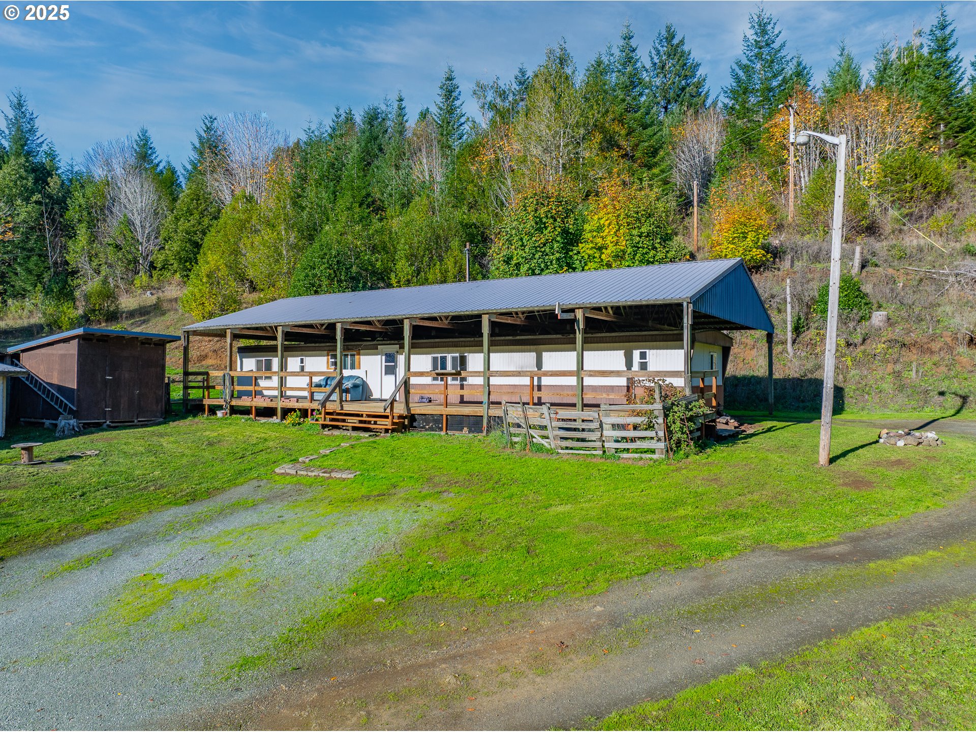 15779 Highway 42 Myrtle Point, OR 97458 - Photo 25 of 33 a view of a house with backyard and garden