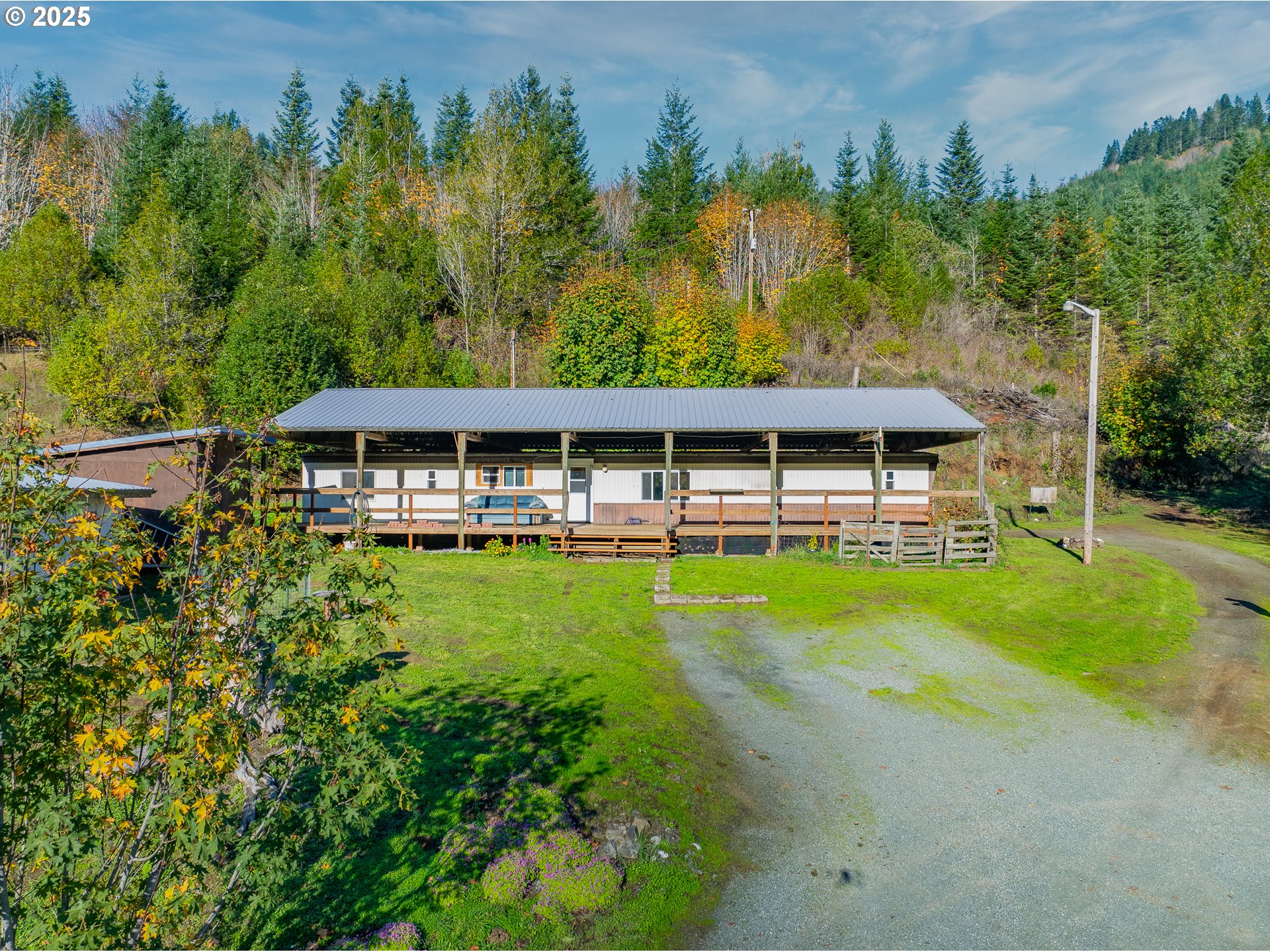 15779 Highway 42 Myrtle Point, OR 97458 - Photo 26 of 33 an aerial view of a house with swimming pool garden view and trees