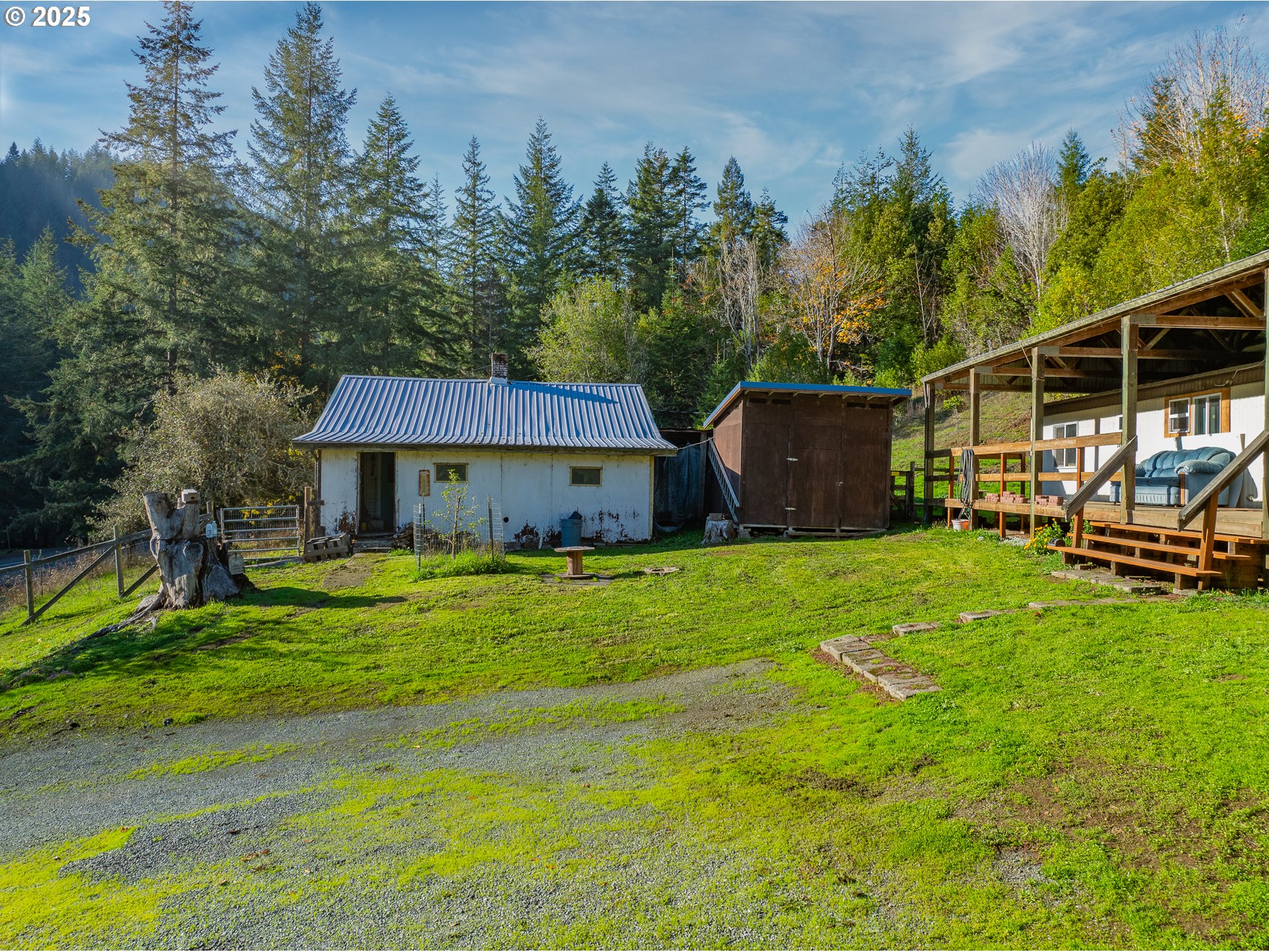 15779 Highway 42 Myrtle Point, OR 97458 - Photo 27 of 33 a view of a house with a yard and sitting area