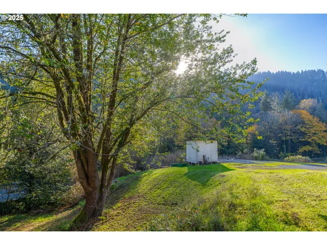a backyard of a house with lots of green space