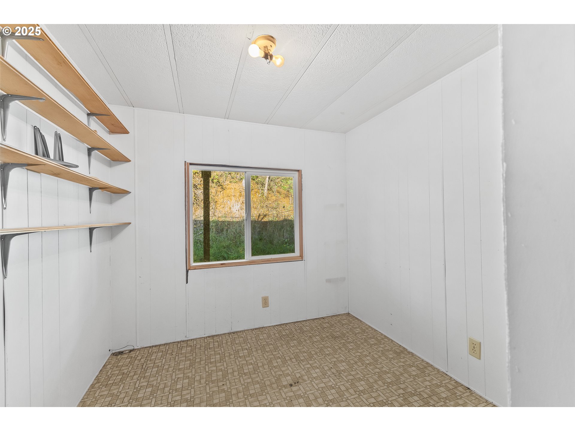 15779 Highway 42 Myrtle Point, OR 97458 - Photo 10 of 33 a view of an empty room with a window