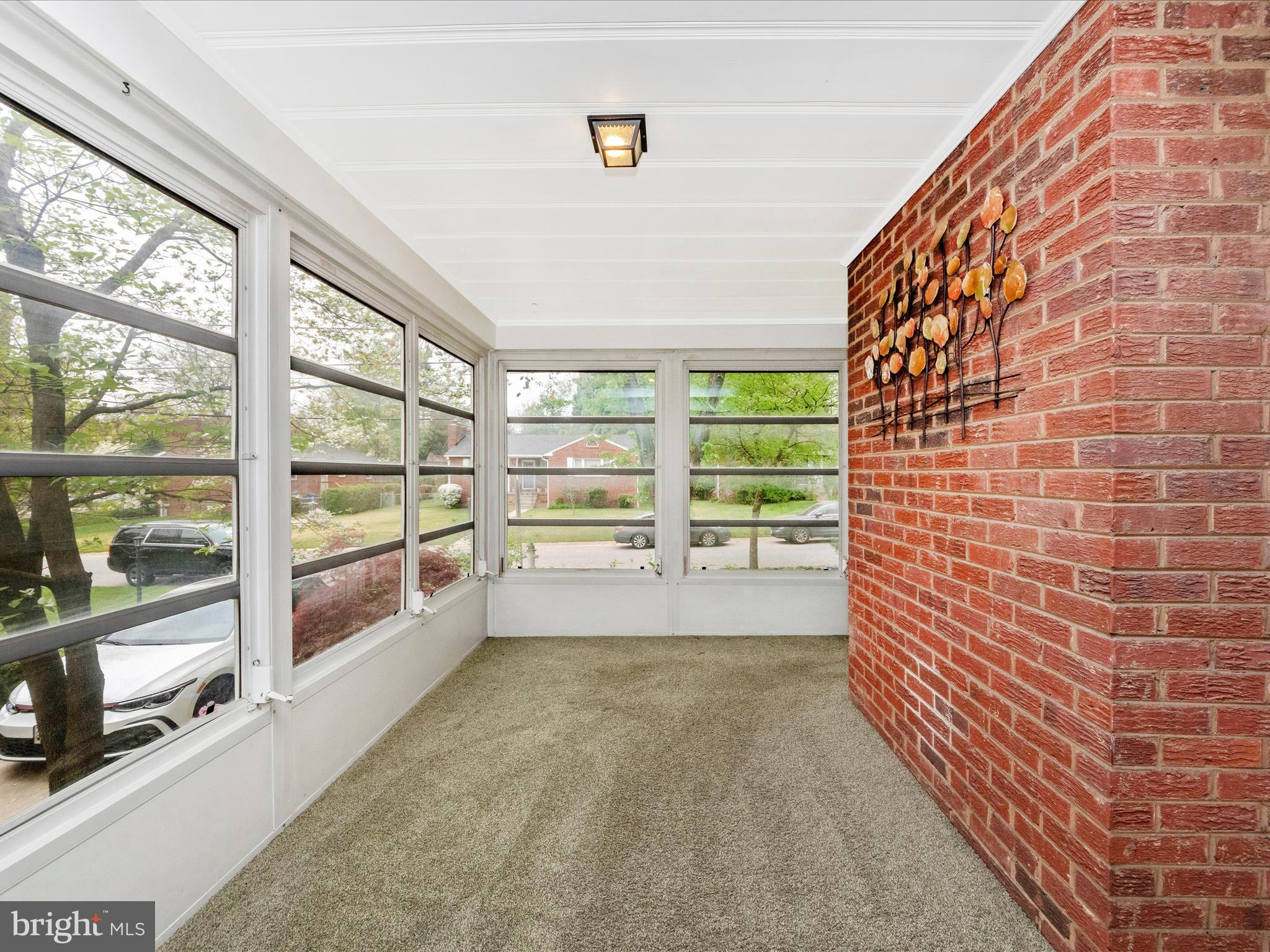 9905 Portland Road Silver Spring, MD 20901 - Photo 15 of 52 a view of an empty room with a floor to ceiling window next to a larger window