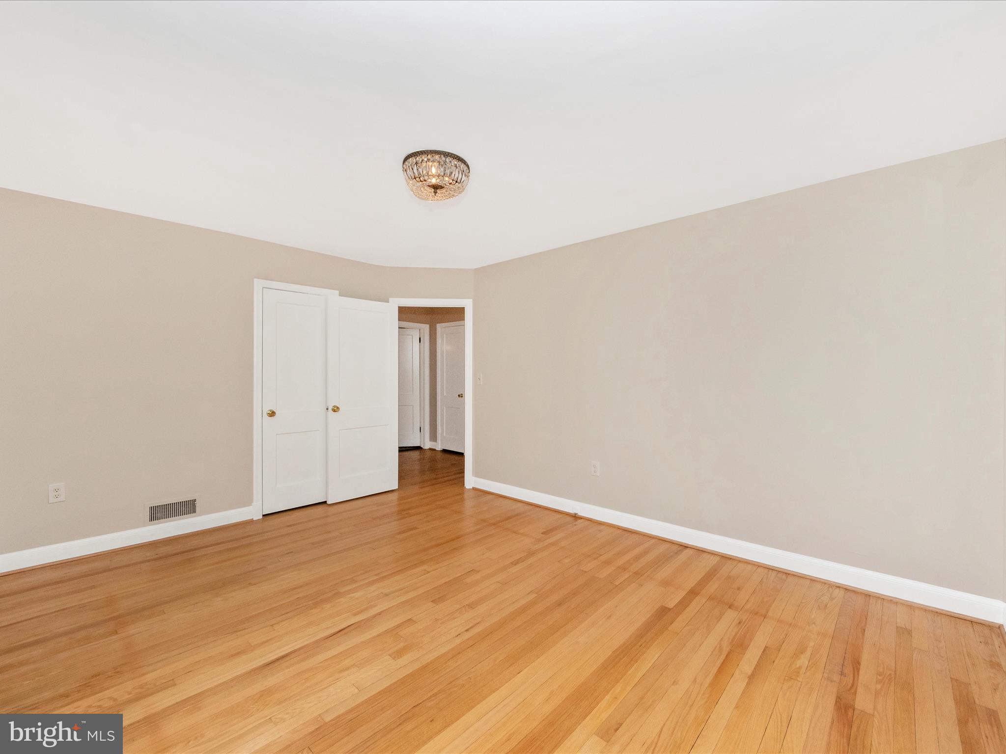 9905 Portland Road Silver Spring, MD 20901 - Photo 19 of 52 an empty room with wooden floor