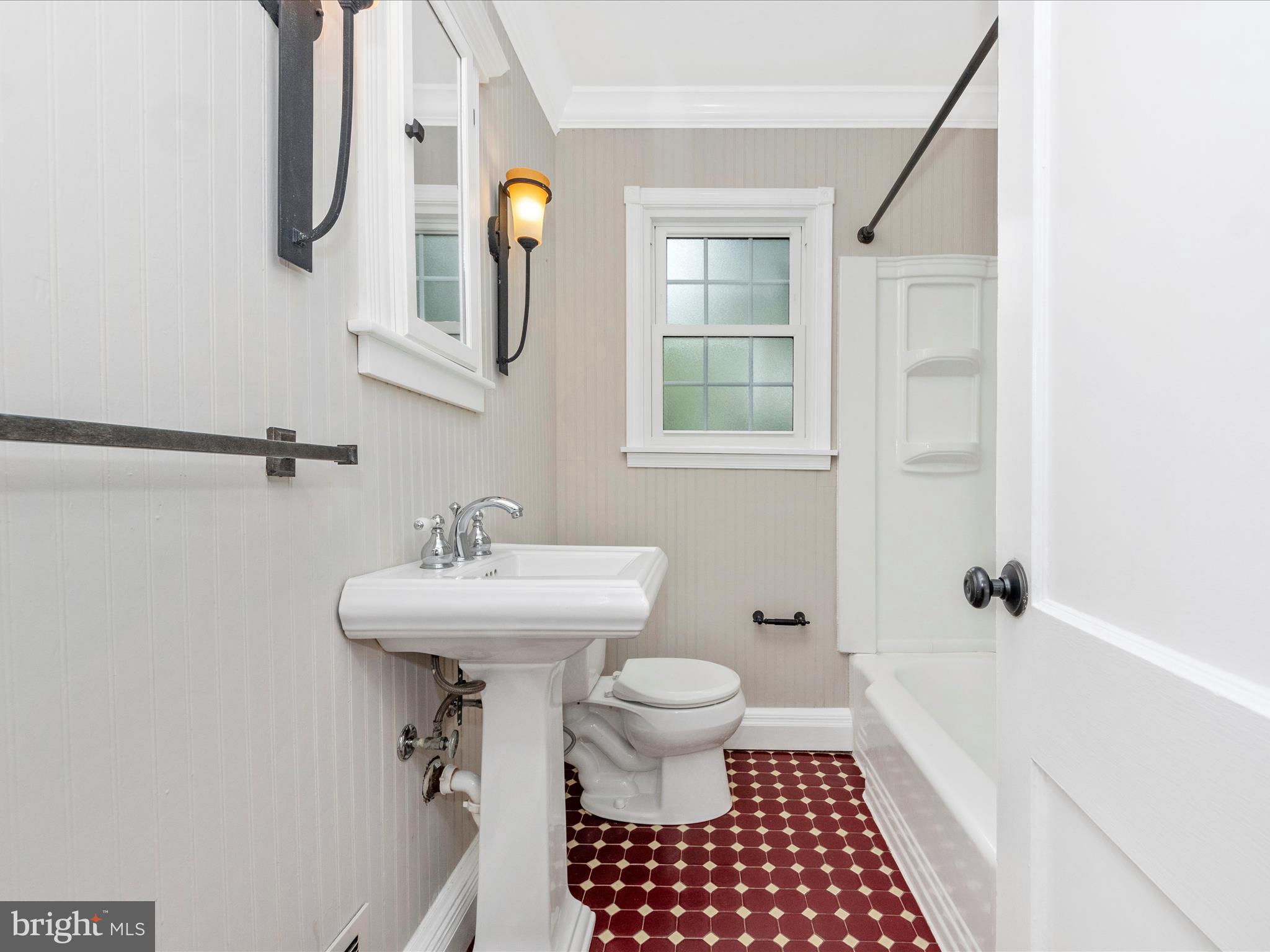 9905 Portland Road Silver Spring, MD 20901 - Photo 21 of 52 a bathroom with a sink a toilet and shower