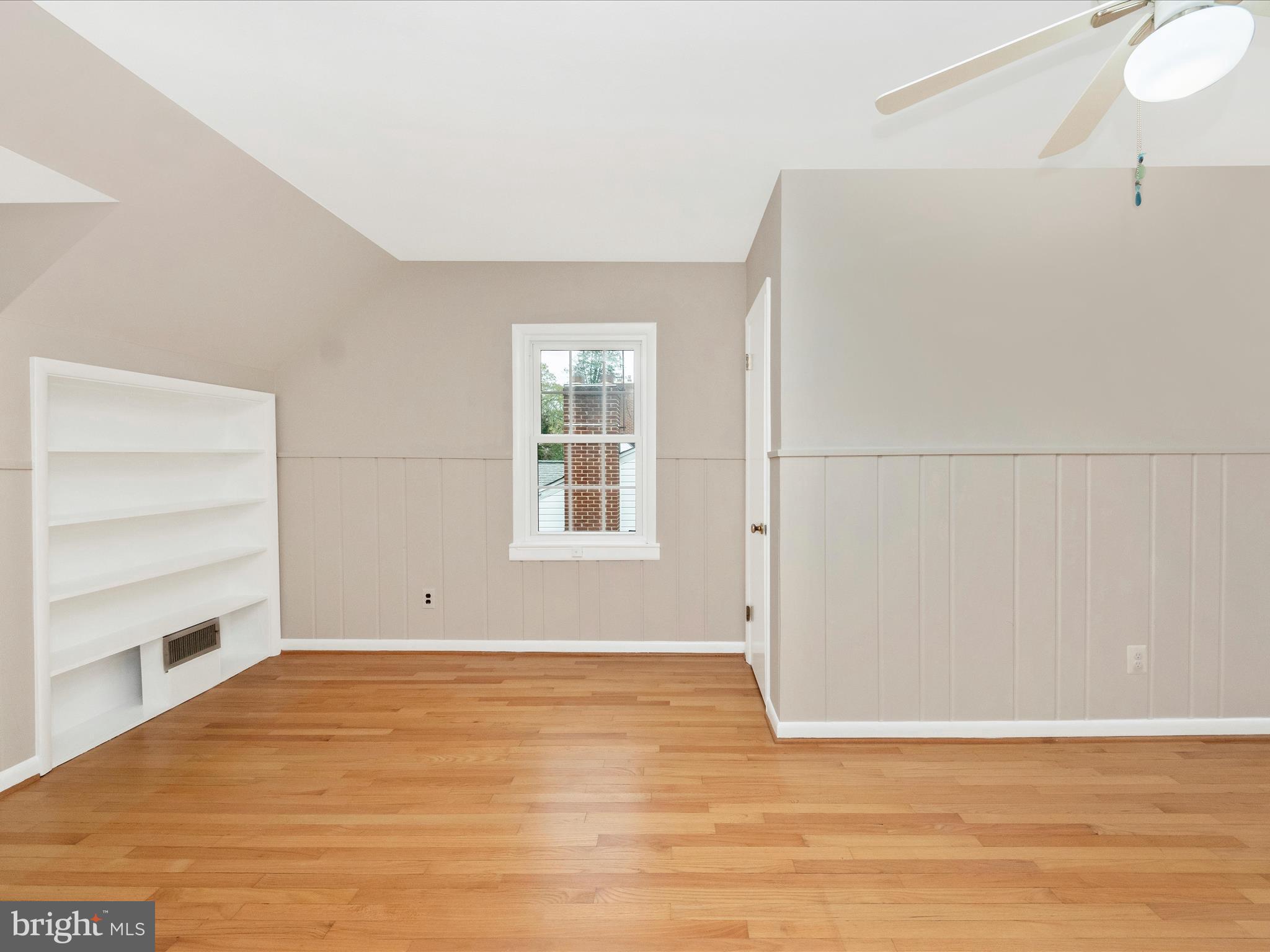 9905 Portland Road Silver Spring, MD 20901 - Photo 27 of 52 a view of an empty room with a window and wooden floor