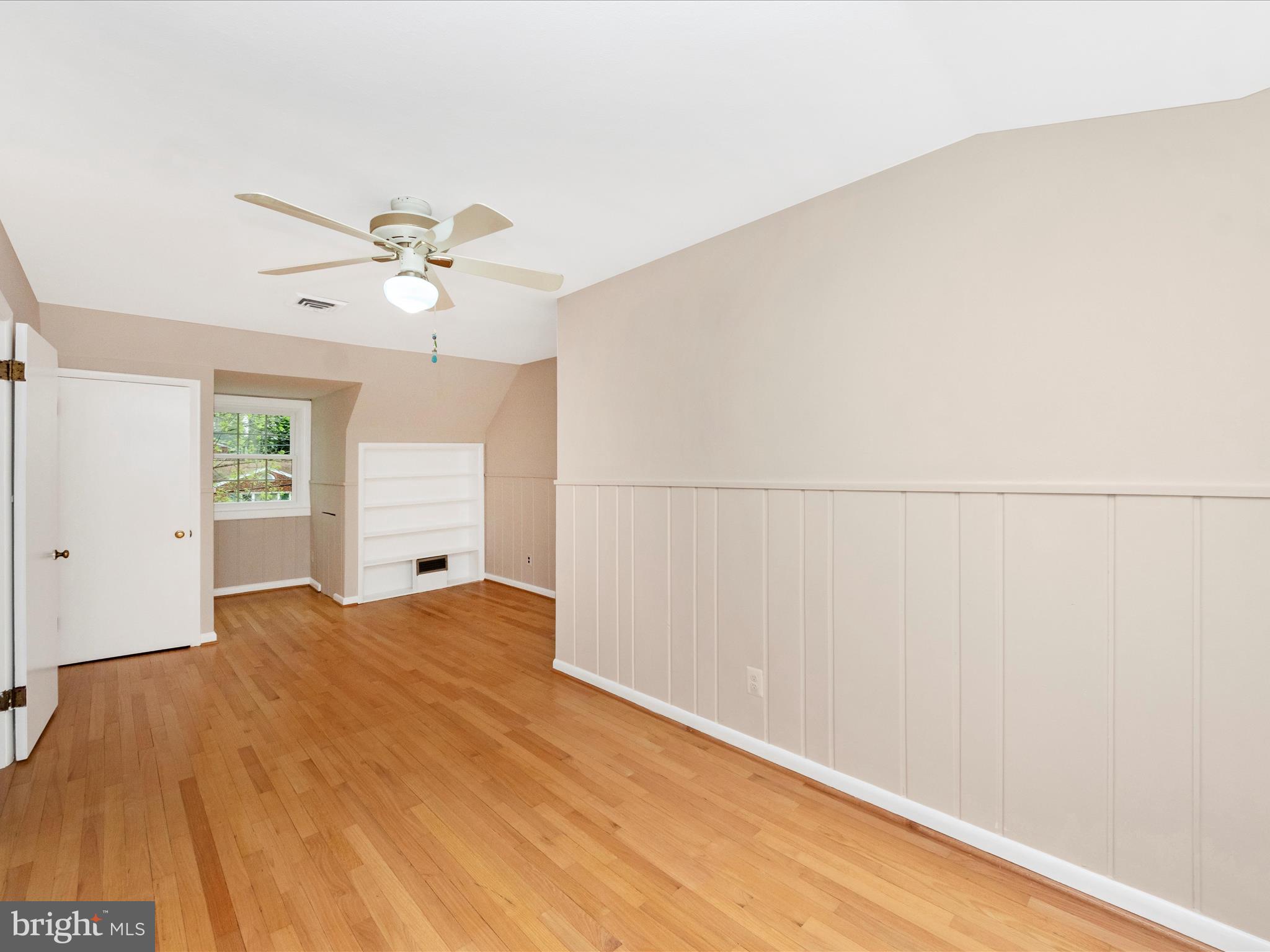 9905 Portland Road Silver Spring, MD 20901 - Photo 30 of 52 a view of a bedroom with wooden floor and window