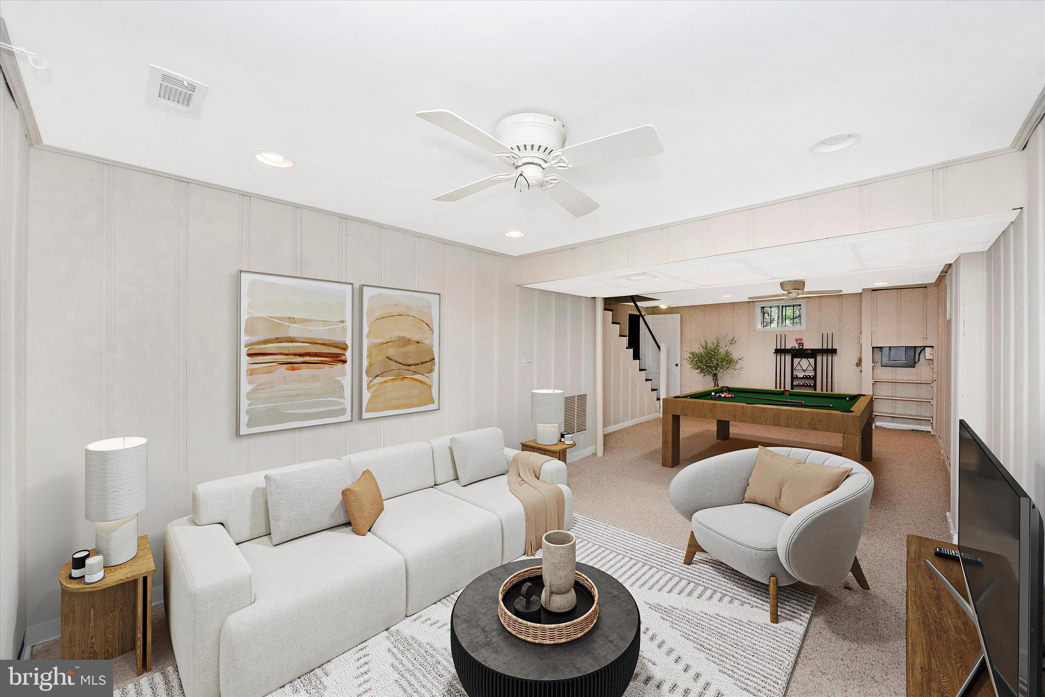 9905 Portland Road Silver Spring, MD 20901 - Photo 36 of 52 a living room with furniture and a wooden floor