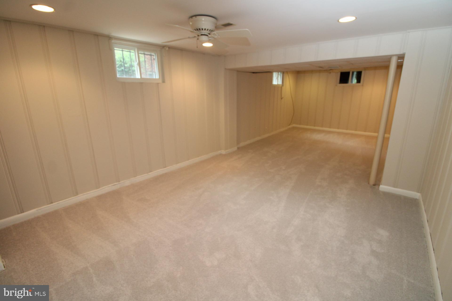 9905 Portland Road Silver Spring, MD 20901 - Photo 37 of 52 an empty room with windows and closet