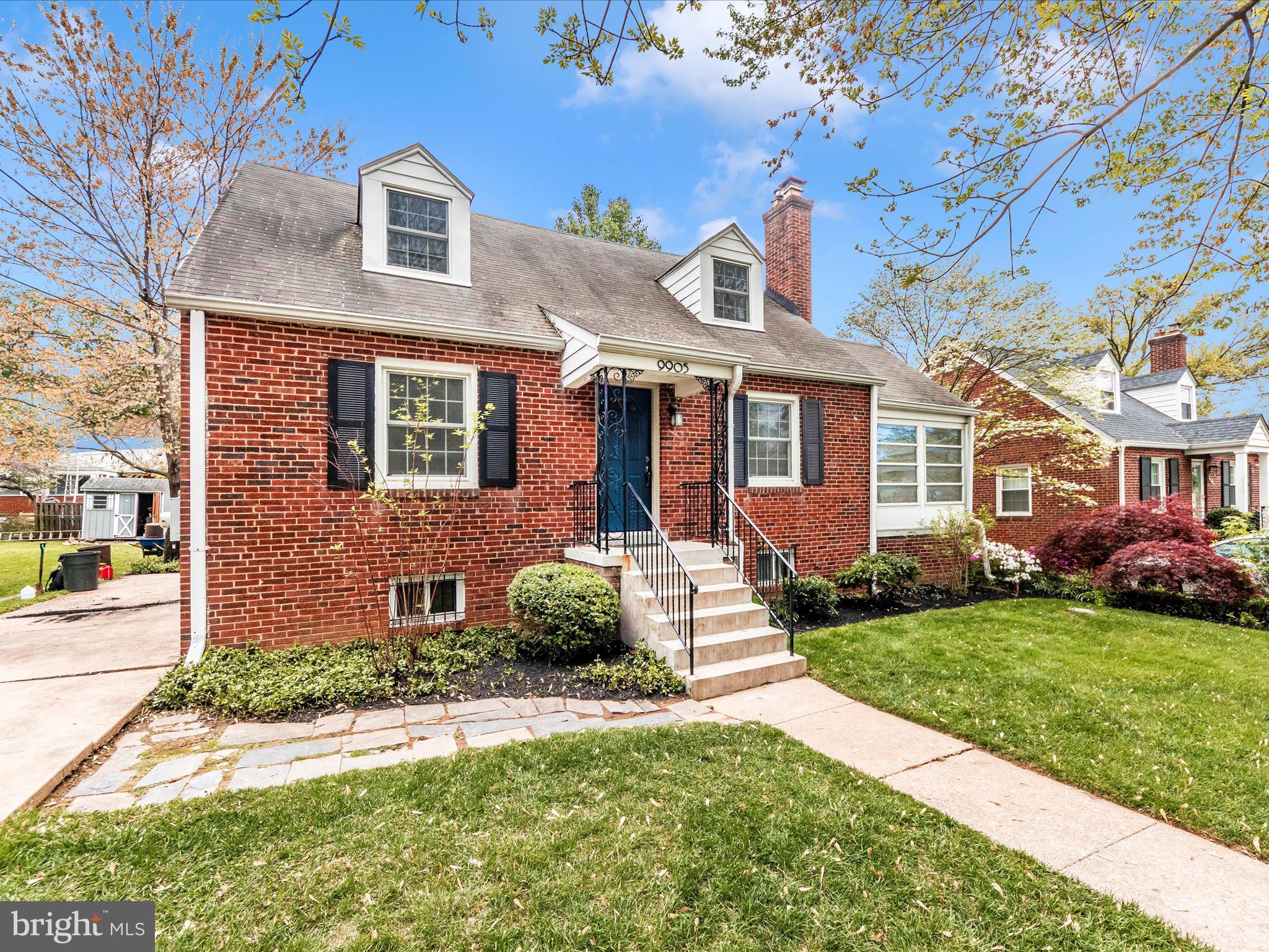 9905 Portland Road Silver Spring, MD 20901 - Photo 46 of 52 a front view of a house with a yard