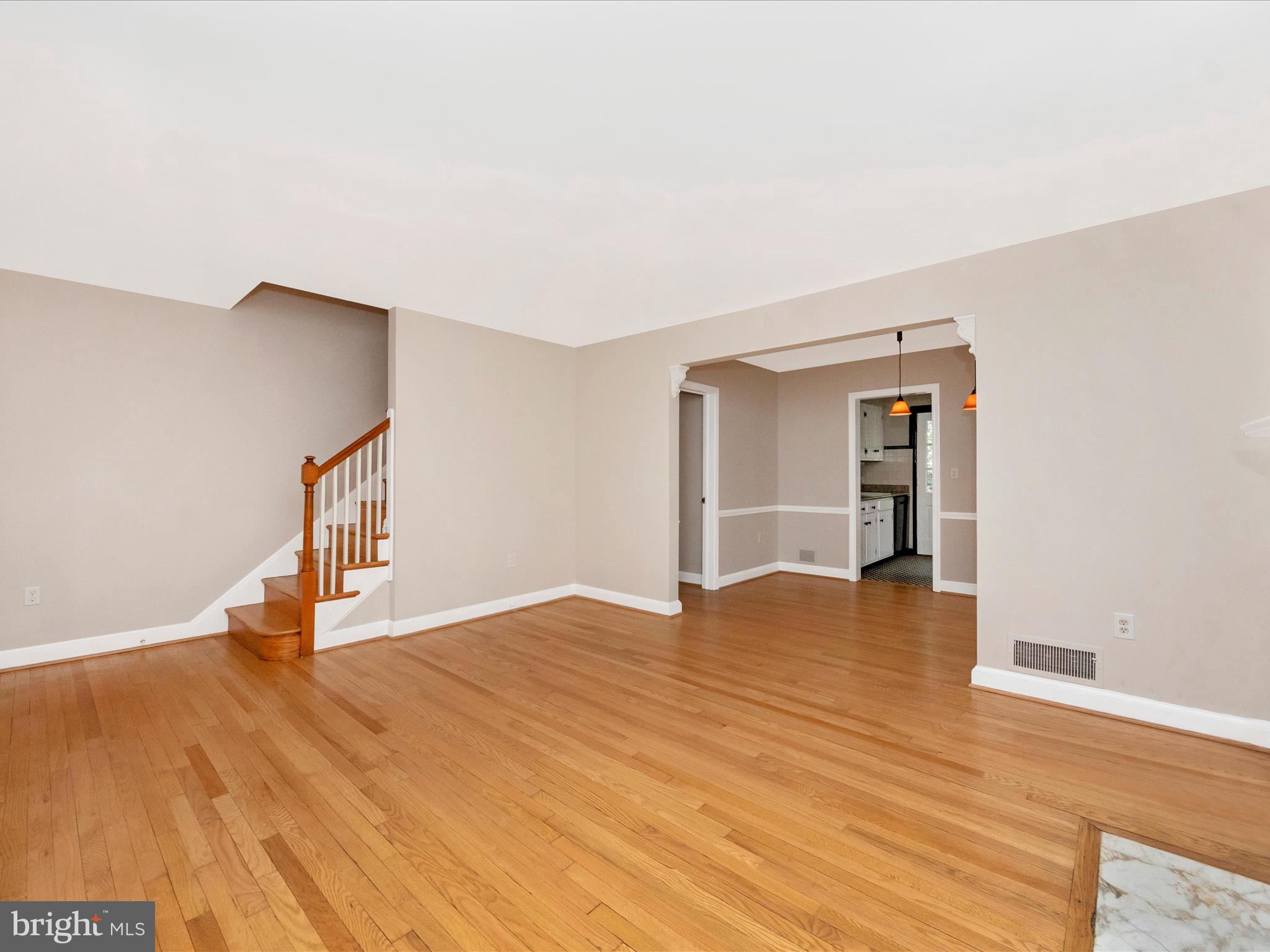 9905 Portland Road Silver Spring, MD 20901 - Photo 5 of 52 a view of an empty room with wooden floor and a window