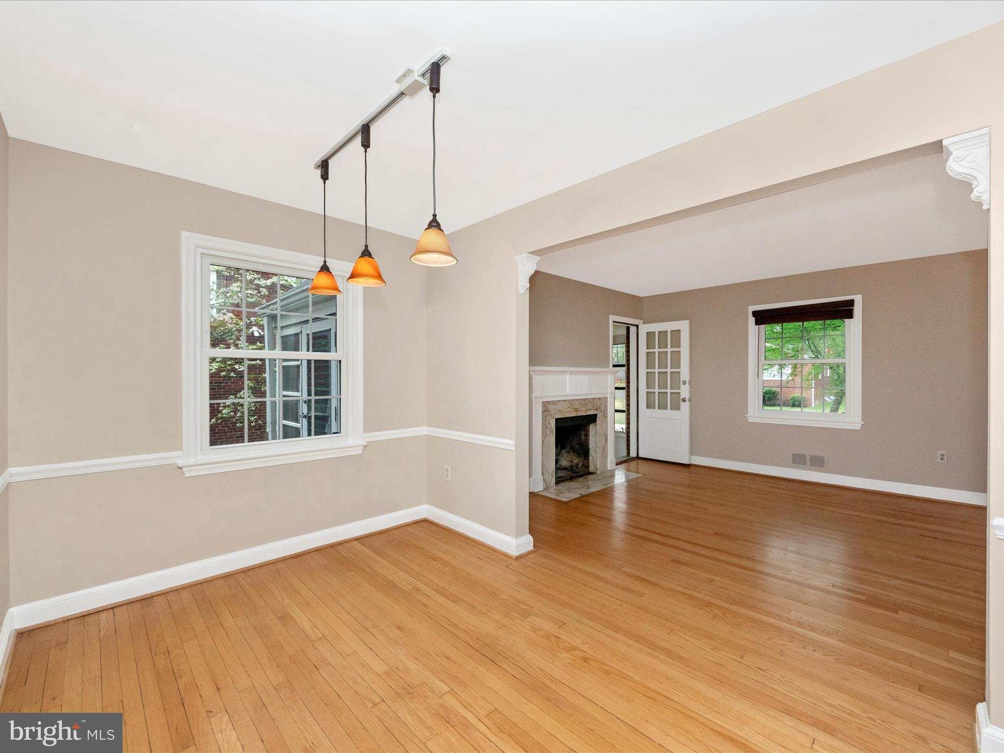 9905 Portland Road Silver Spring, MD 20901 - Photo 9 of 52 a view of an empty room with wooden floor and a window