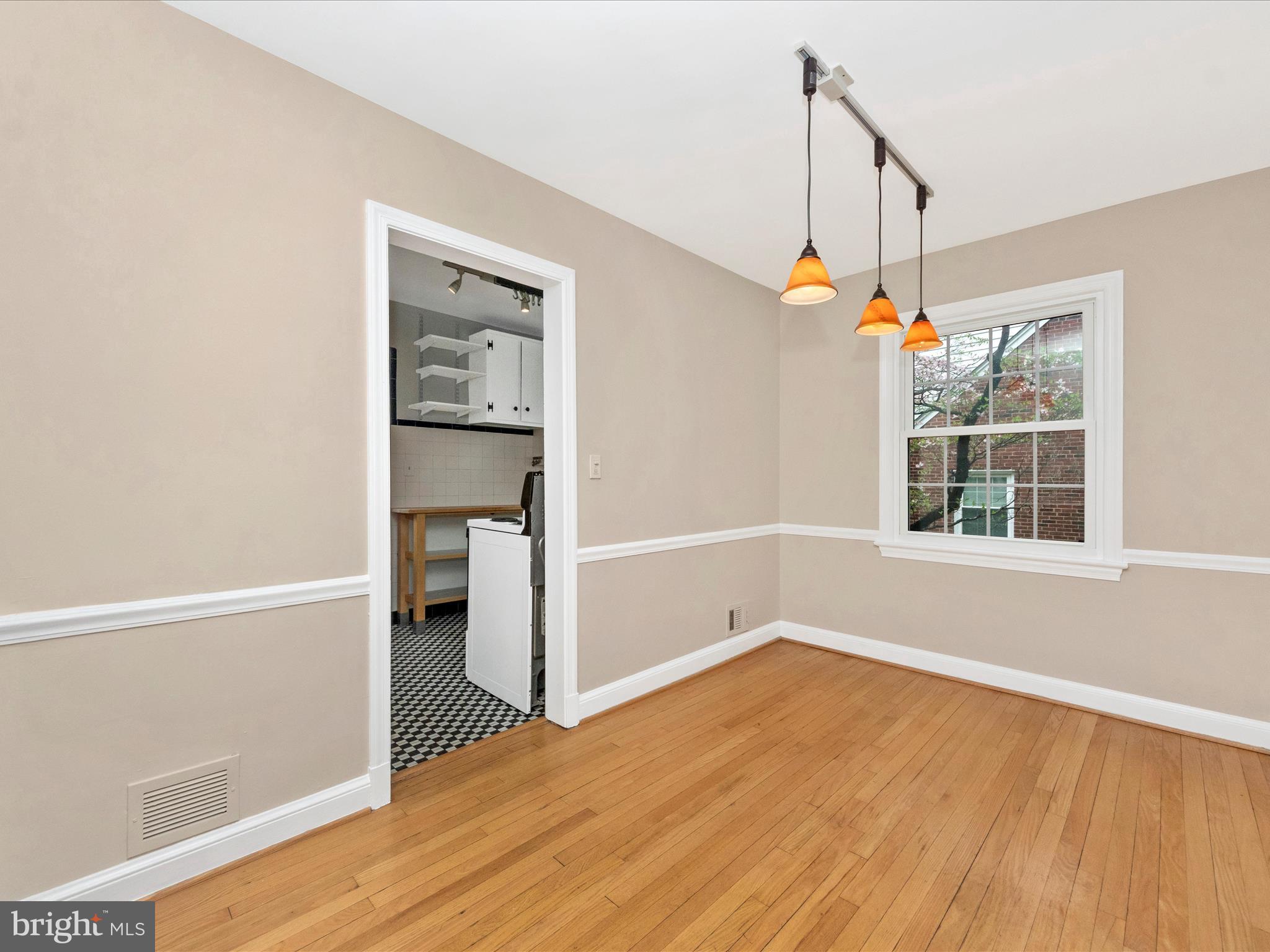9905 Portland Road Silver Spring, MD 20901 - Photo 10 of 52 a view of an empty room with wooden floor and a window
