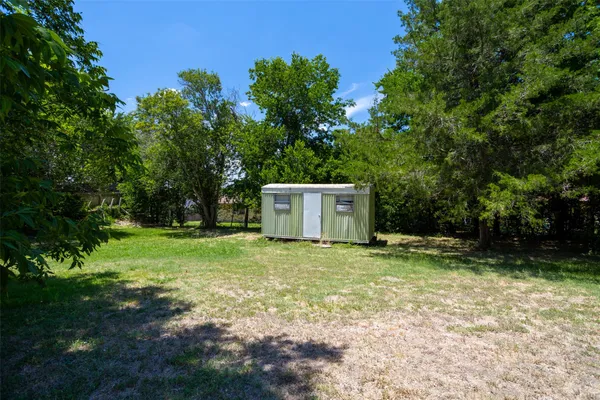 a fire hydrant in the middle of a field
