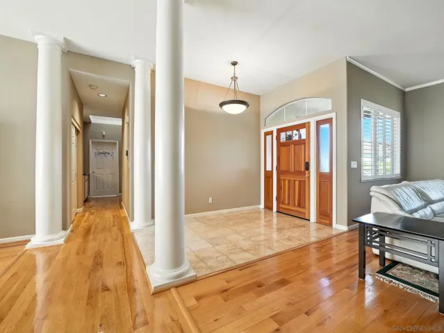a view of a livingroom with furniture window and wooden floor