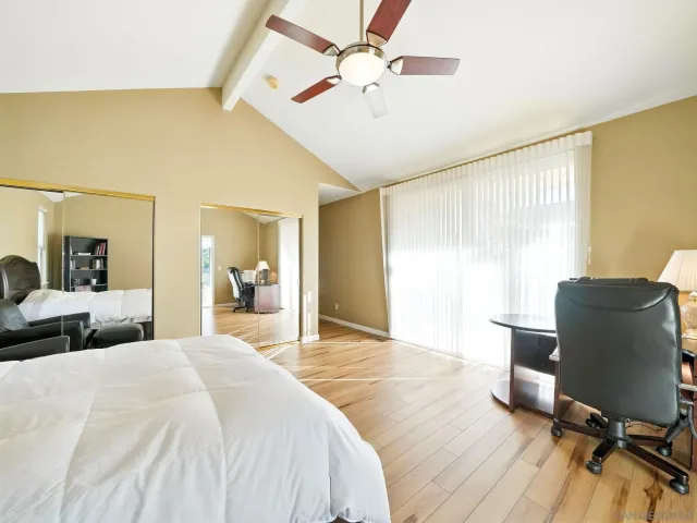 a bedroom with a bed and a chair