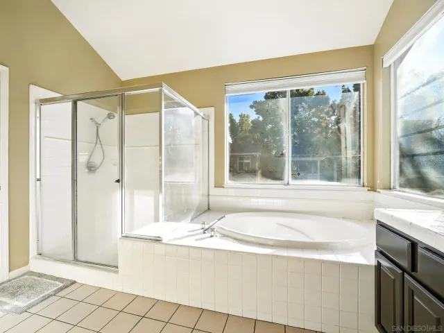a living room with a large window and table
