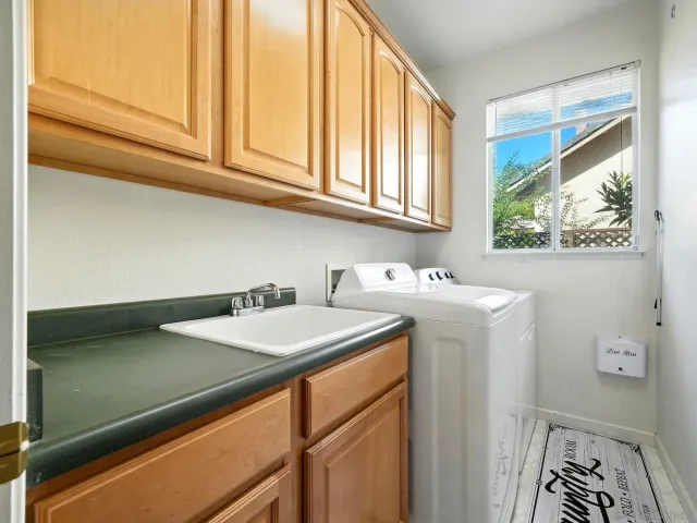 a bathroom with a sink and a window