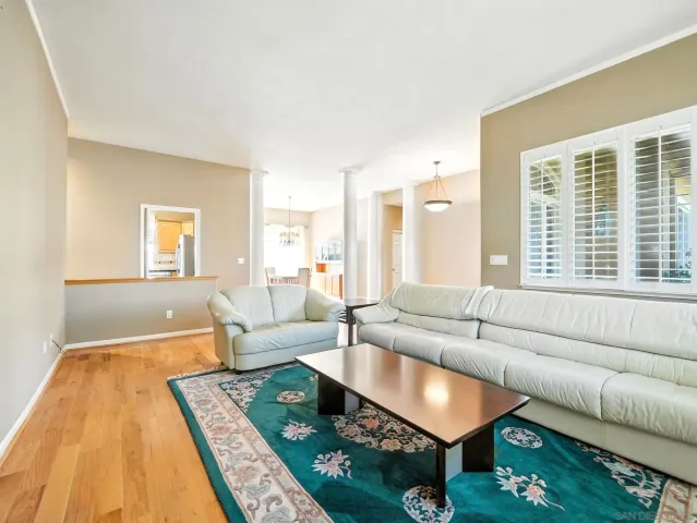 a living room with furniture and a rug
