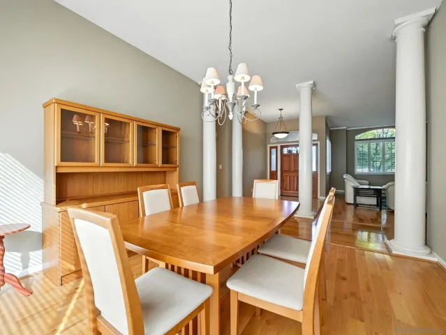 a dining room with furniture and chandelier