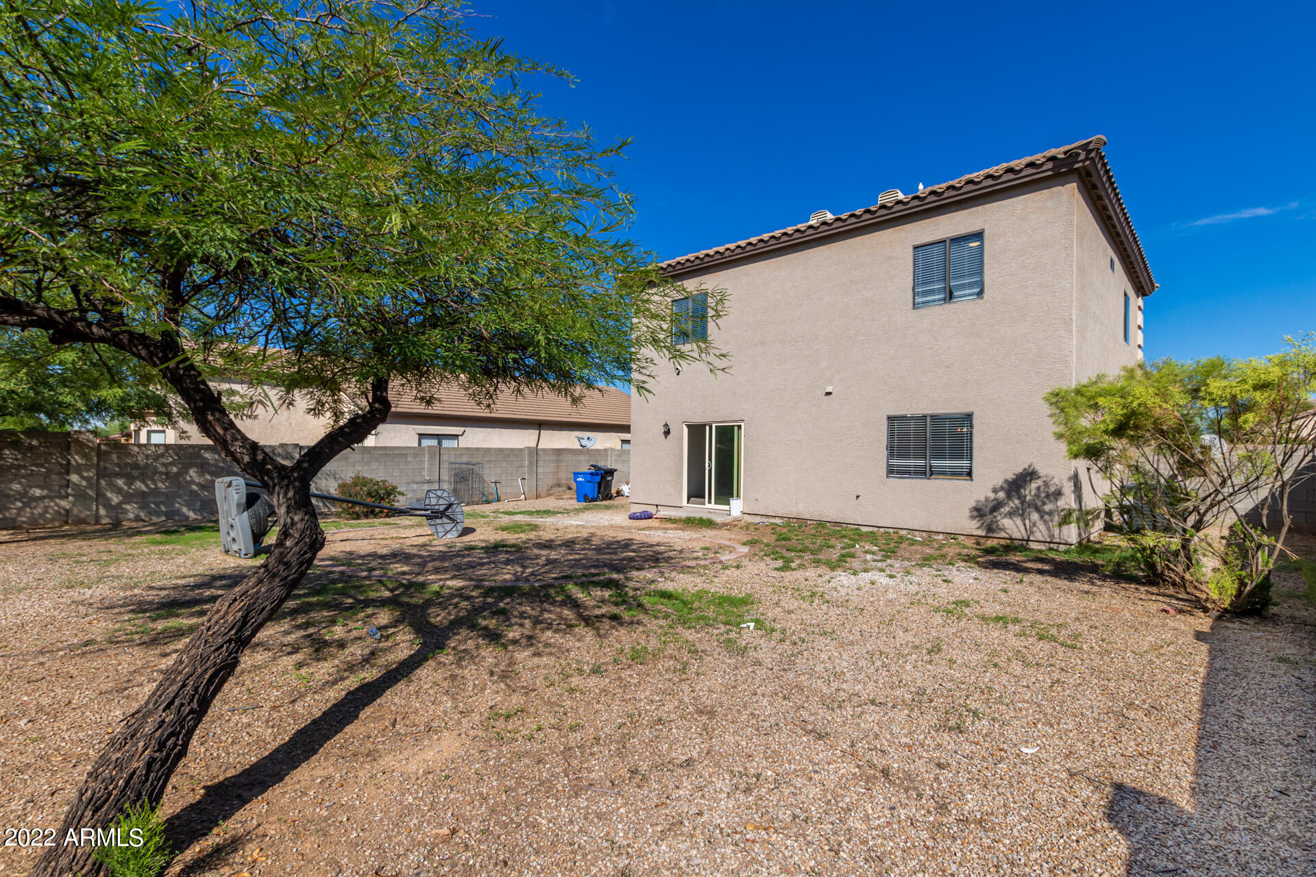 1315 West Fremont Rd. Phoenix, AZ 85041 - Photo 20 of 22 a view of a house with a yard