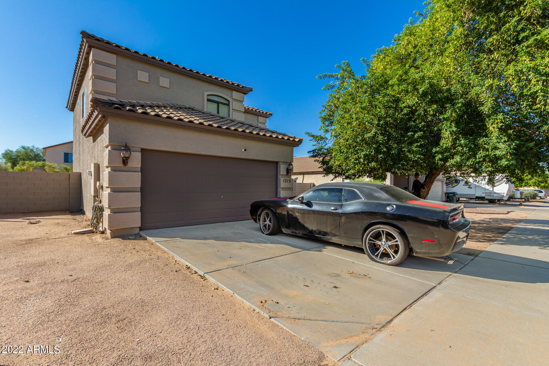 1315 West Fremont Rd. Phoenix, AZ 85041 - Photo 3 of 22 a car parked in front of a house