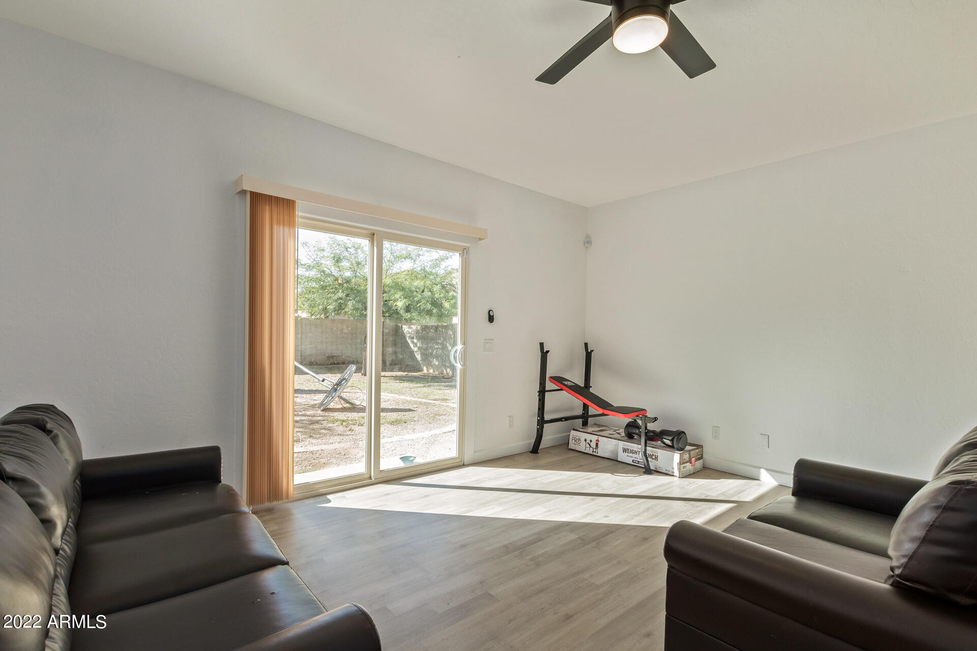 1315 West Fremont Rd. Phoenix, AZ 85041 - Photo 5 of 22 a living room with furniture and a window