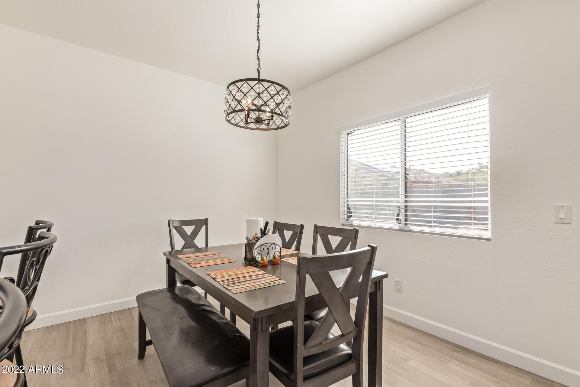 1315 West Fremont Rd. Phoenix, AZ 85041 - Photo 7 of 22 a view of a dining room with a table and chairs