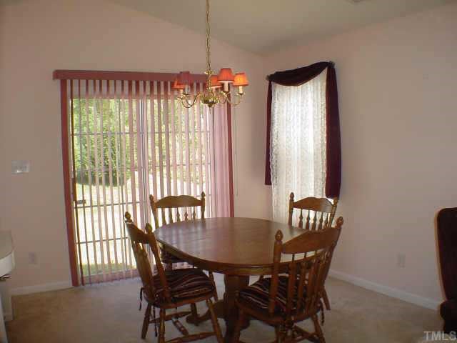 4916 Silverdene Street Raleigh, NC 27616 - Photo 4 of 10 a view of a dining room with furniture and window