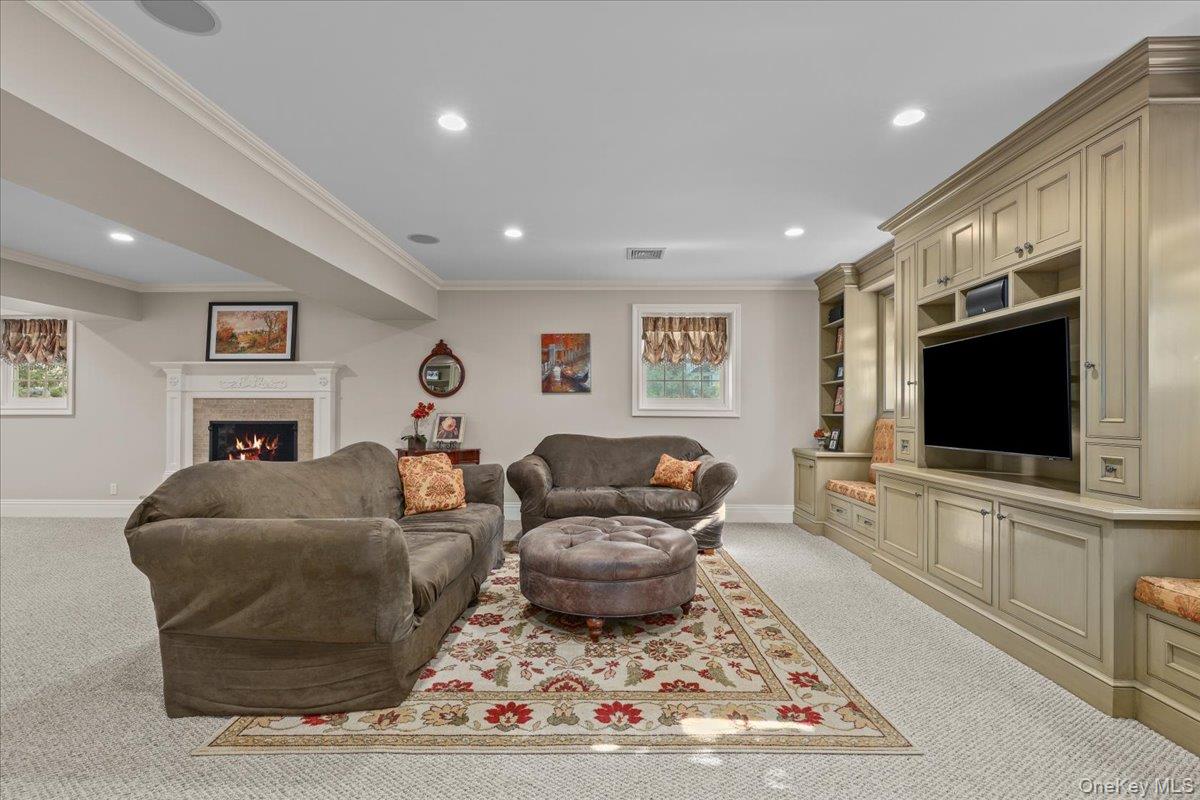 135 Pines Bridge Road Katonah, NY 10536 - Photo 32 of 40 a living room with furniture and a flat screen tv