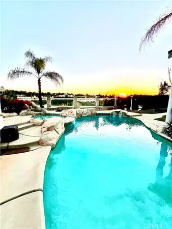a view of swimming pool with a patio