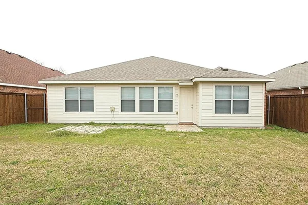 a house that has a big yard in front of it