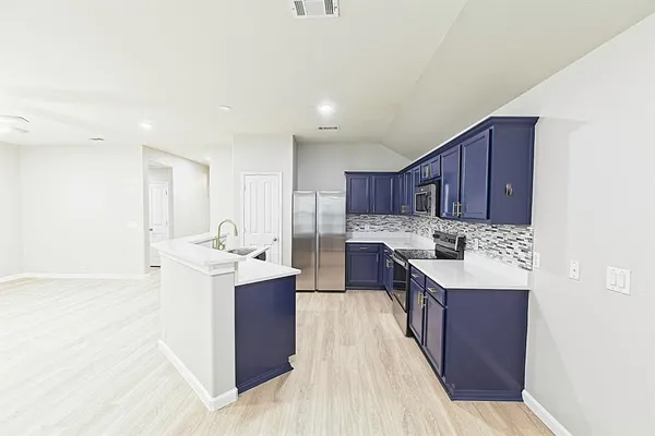 a sink with a mirror and vanity