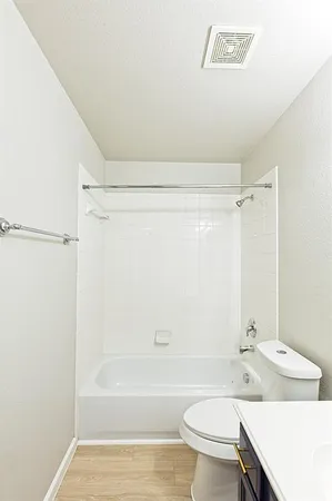 a bathroom with a sink a toilet and a bathtub