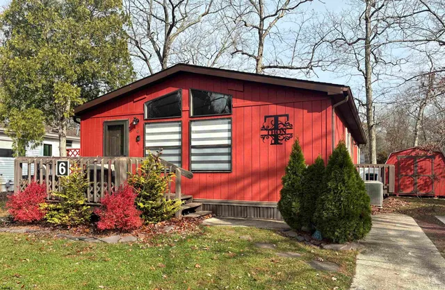 a front view of house with an outdoor space