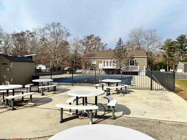 a view of a patio with swimming pool