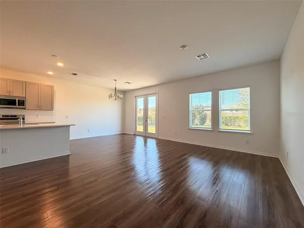 a view of kitchen with furniture and wooden floor