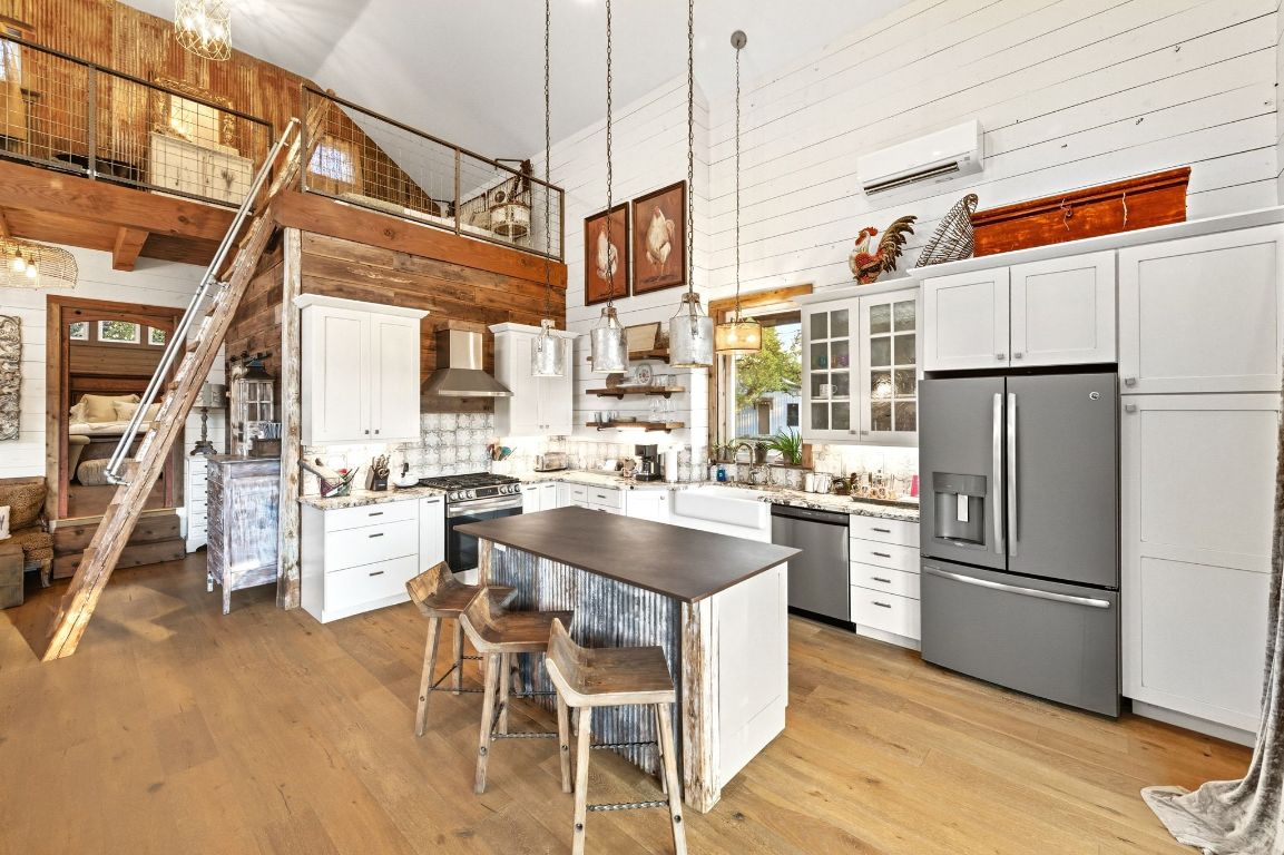 1910 Sandy Point Road Wimberley, TX 78676 - Photo 21 of 40 a kitchen with refrigerator and cabinets