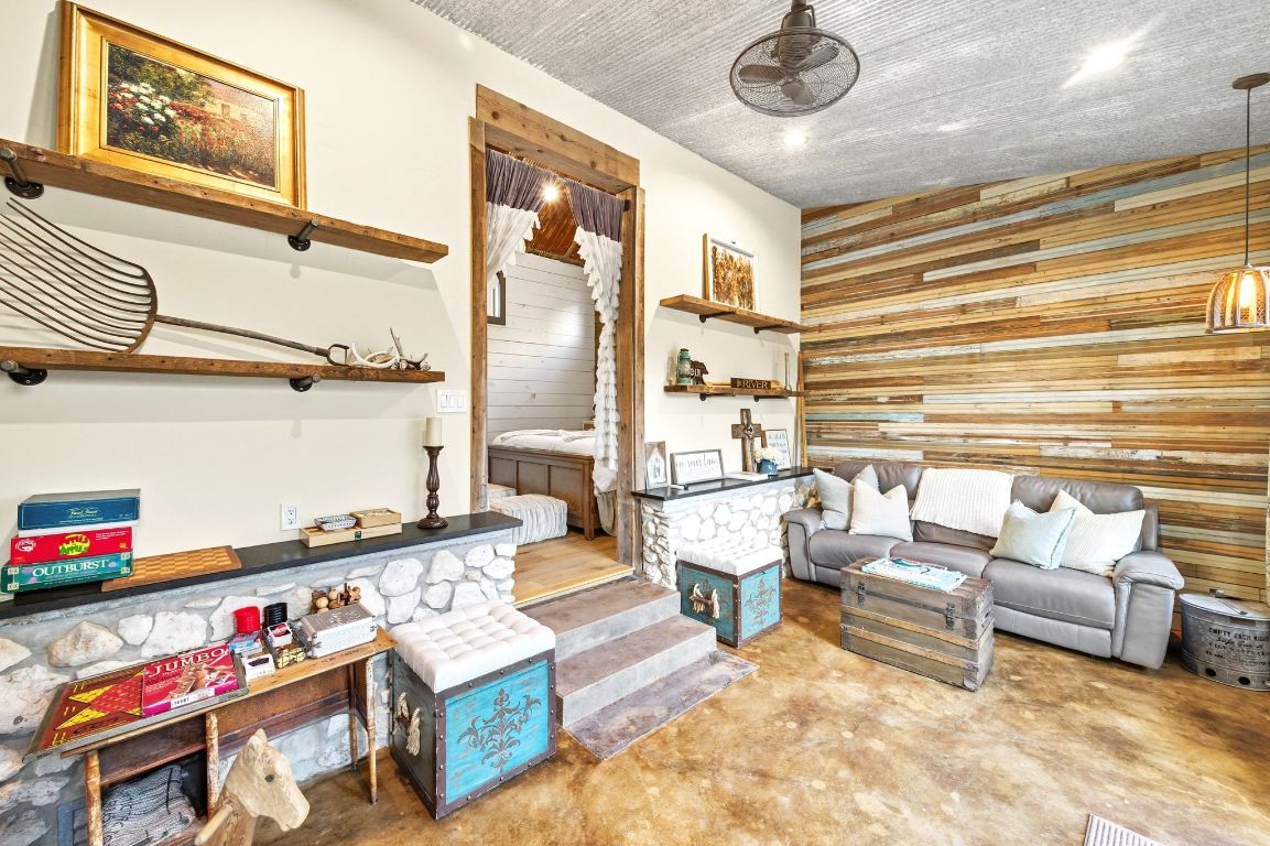1910 Sandy Point Road Wimberley, TX 78676 - Photo 25 of 40 a living room with furniture and a table