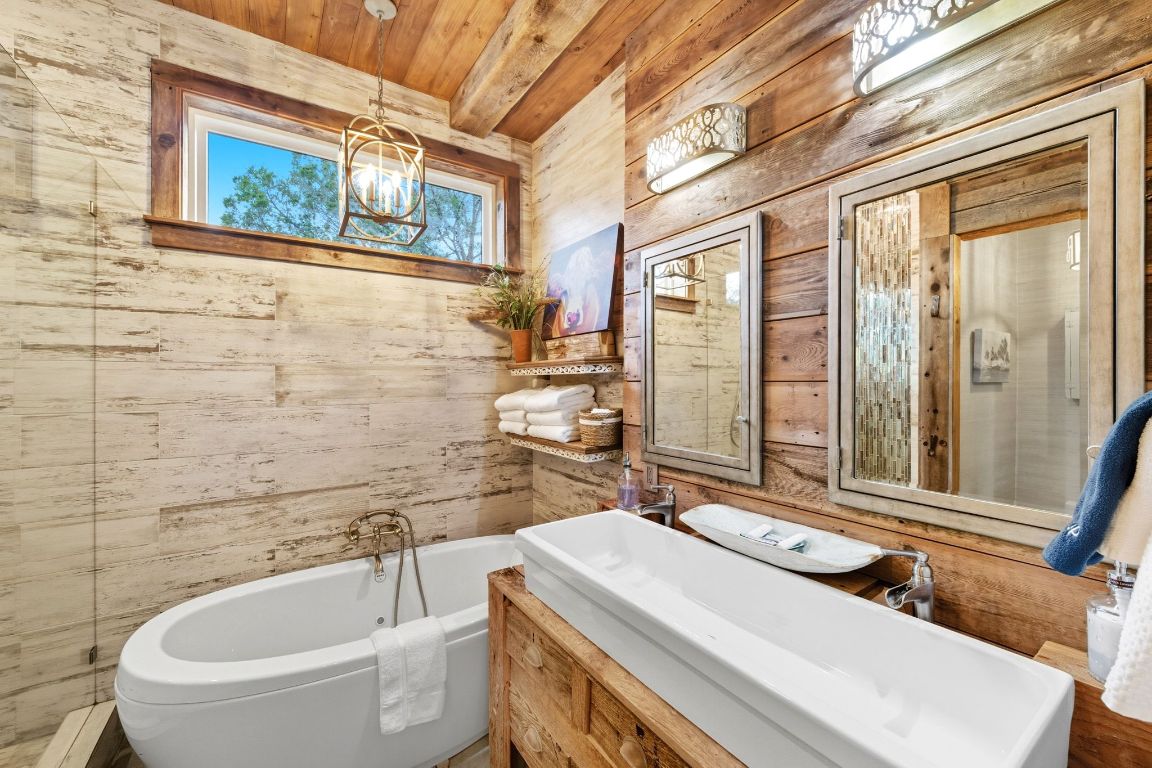 1910 Sandy Point Road Wimberley, TX 78676 - Photo 29 of 40 a bathroom with a sink and a bathtub