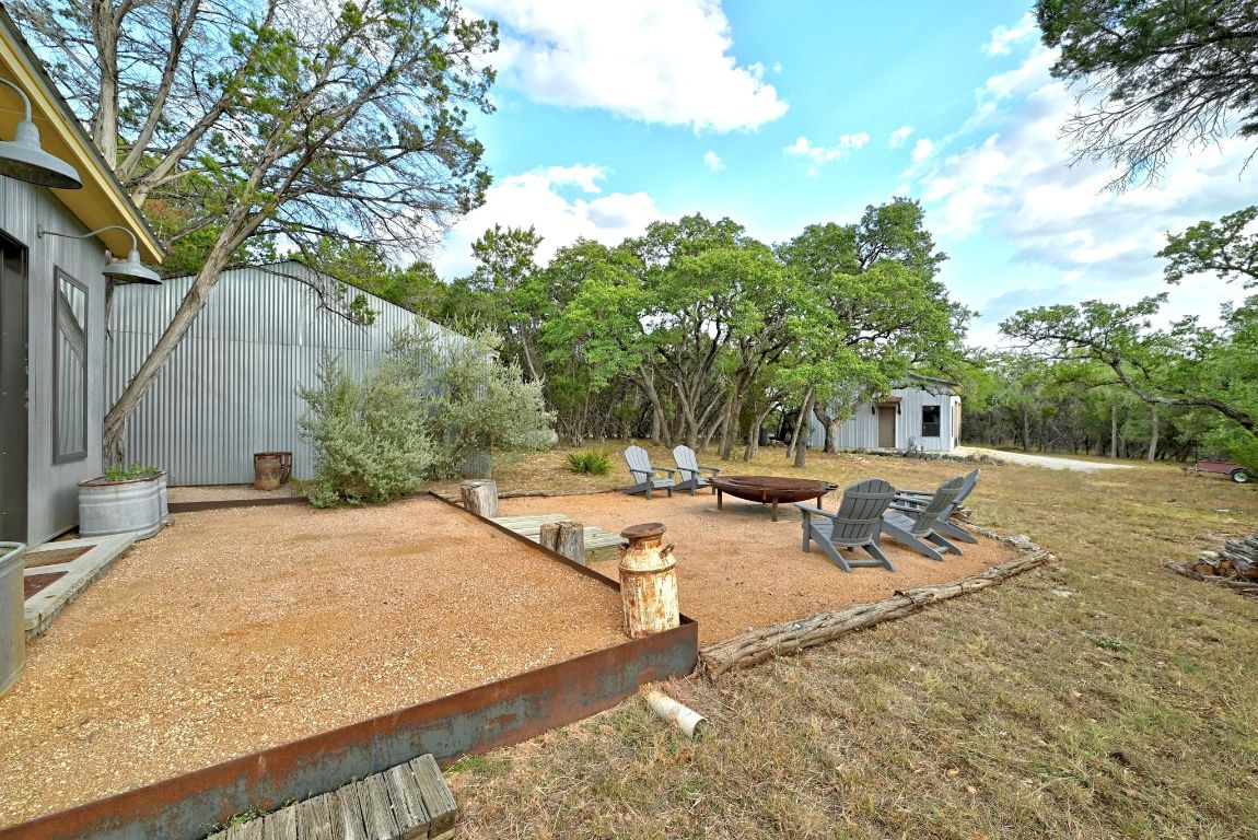 1910 Sandy Point Road Wimberley, TX 78676 - Photo 5 of 40 a view of a backyard with a sitting area