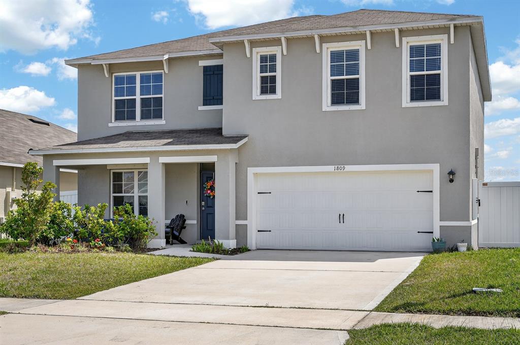 1809 Myrtlebrooke Drive Edgewater, FL 32141 - Photo 2 of 58 a view of a house with backyard and garden