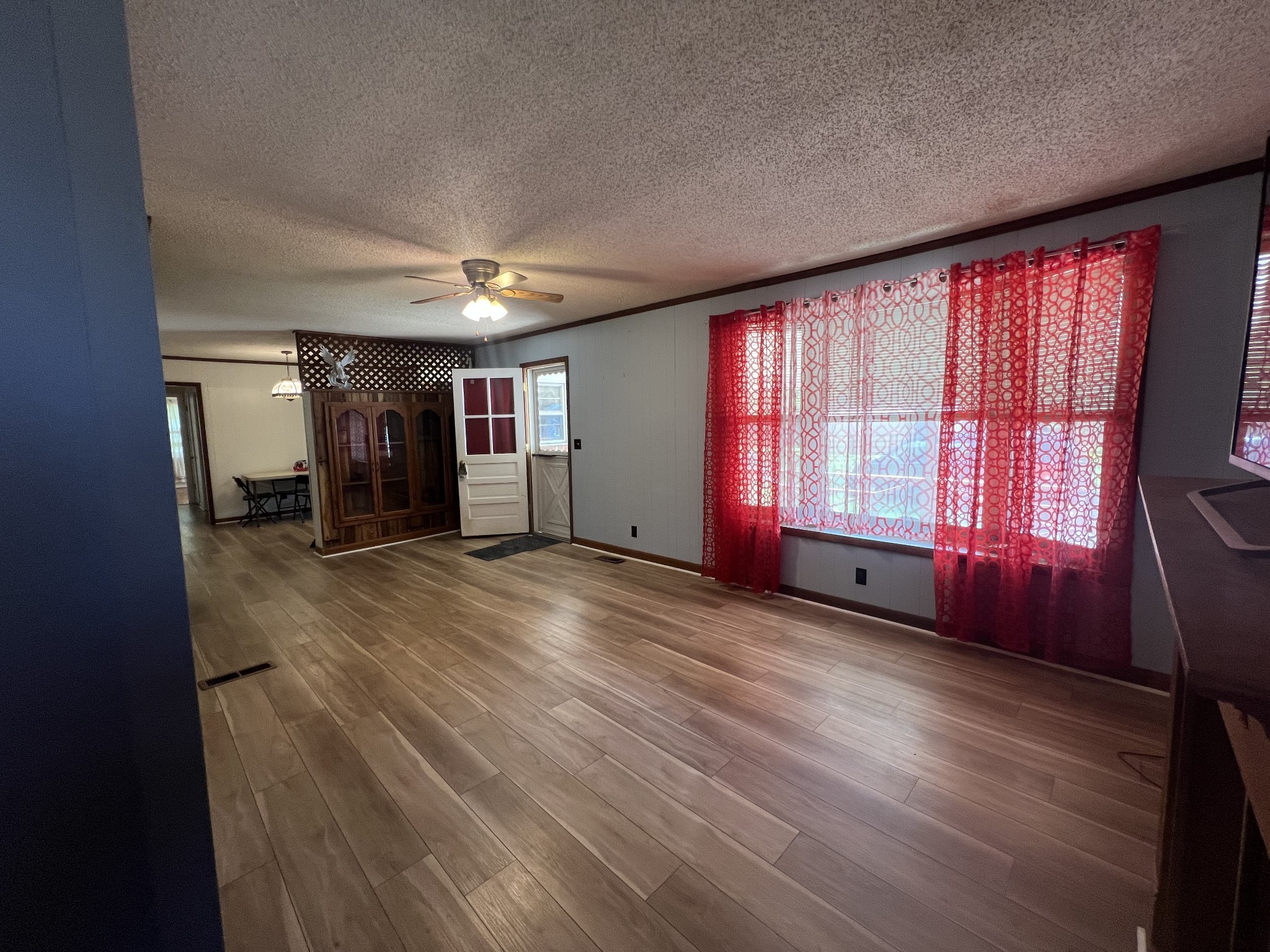1315 Academy Road Portland, TN 37148 - Photo 13 of 29 wooden floor and windows in an empty room