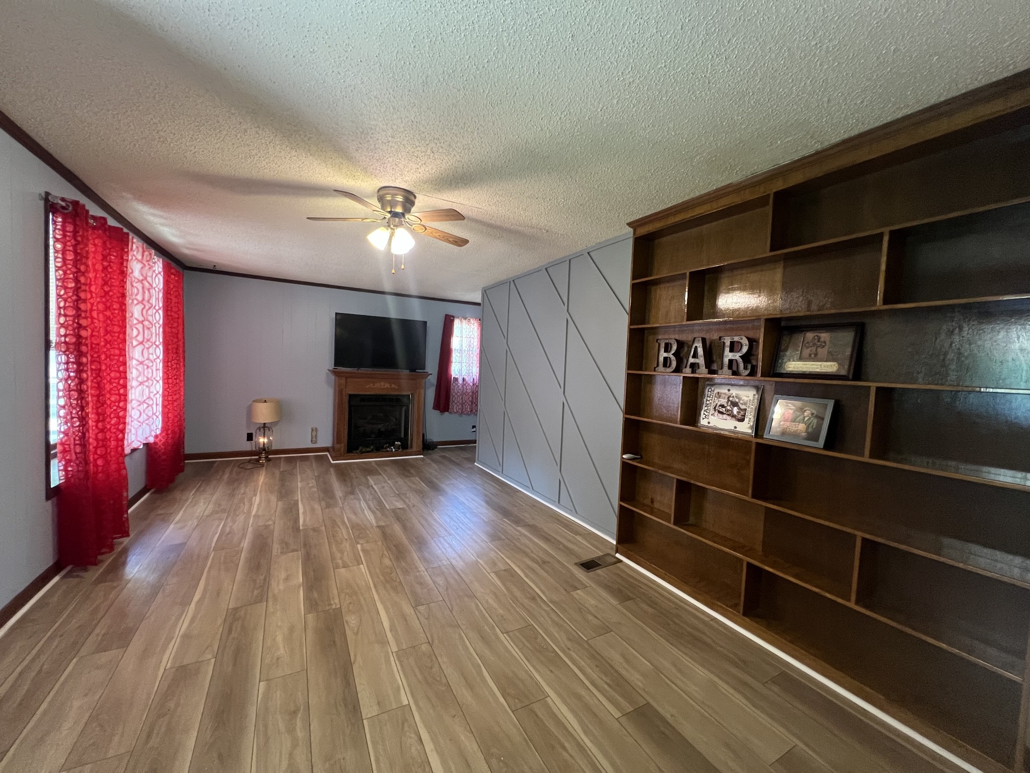 1315 Academy Road Portland, TN 37148 - Photo 14 of 29 a view of a livingroom with furniture and chandelier fan