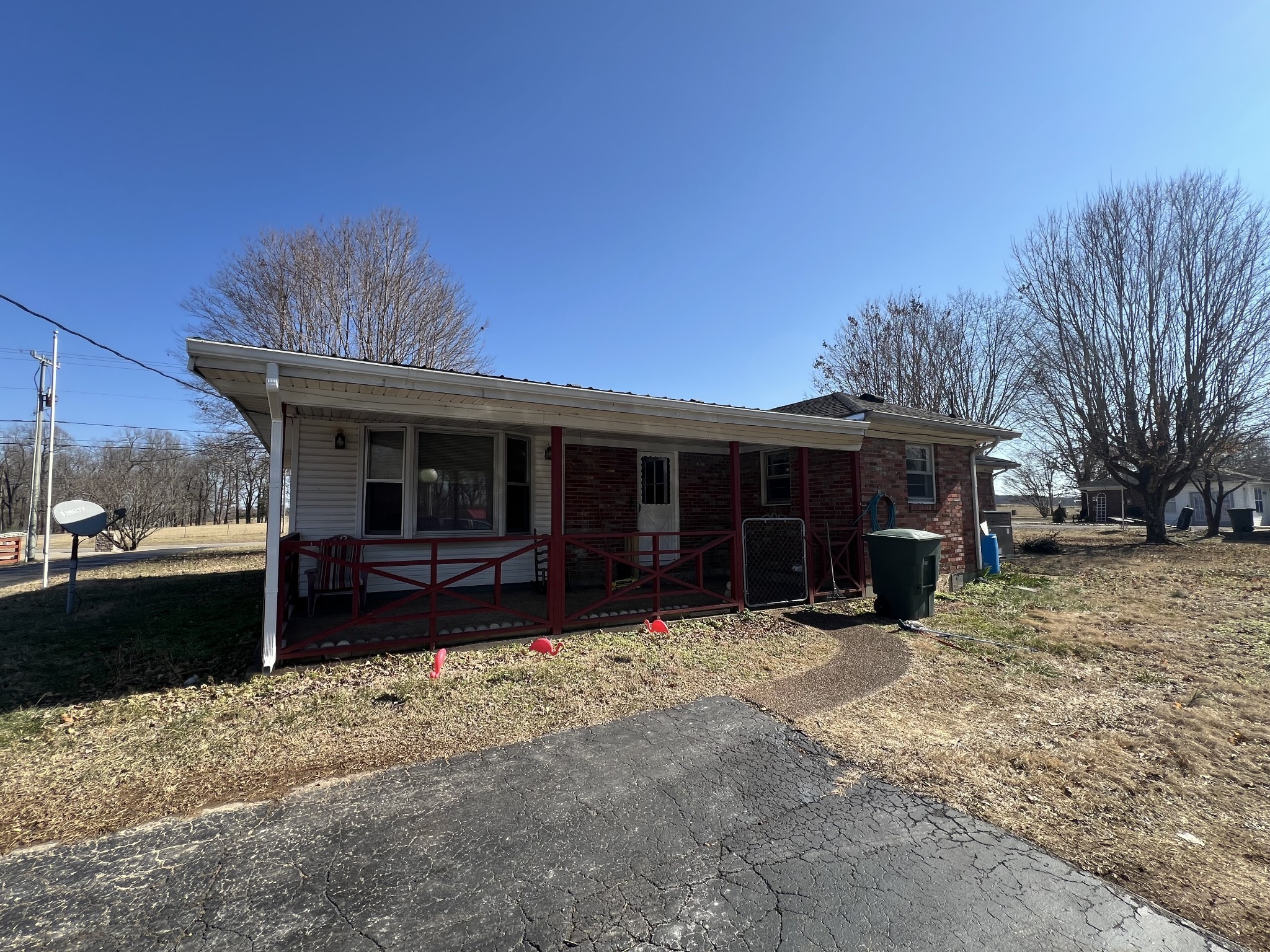 1315 Academy Road Portland, TN 37148 - Photo 6 of 29 a view of a house with a yard covered in snow